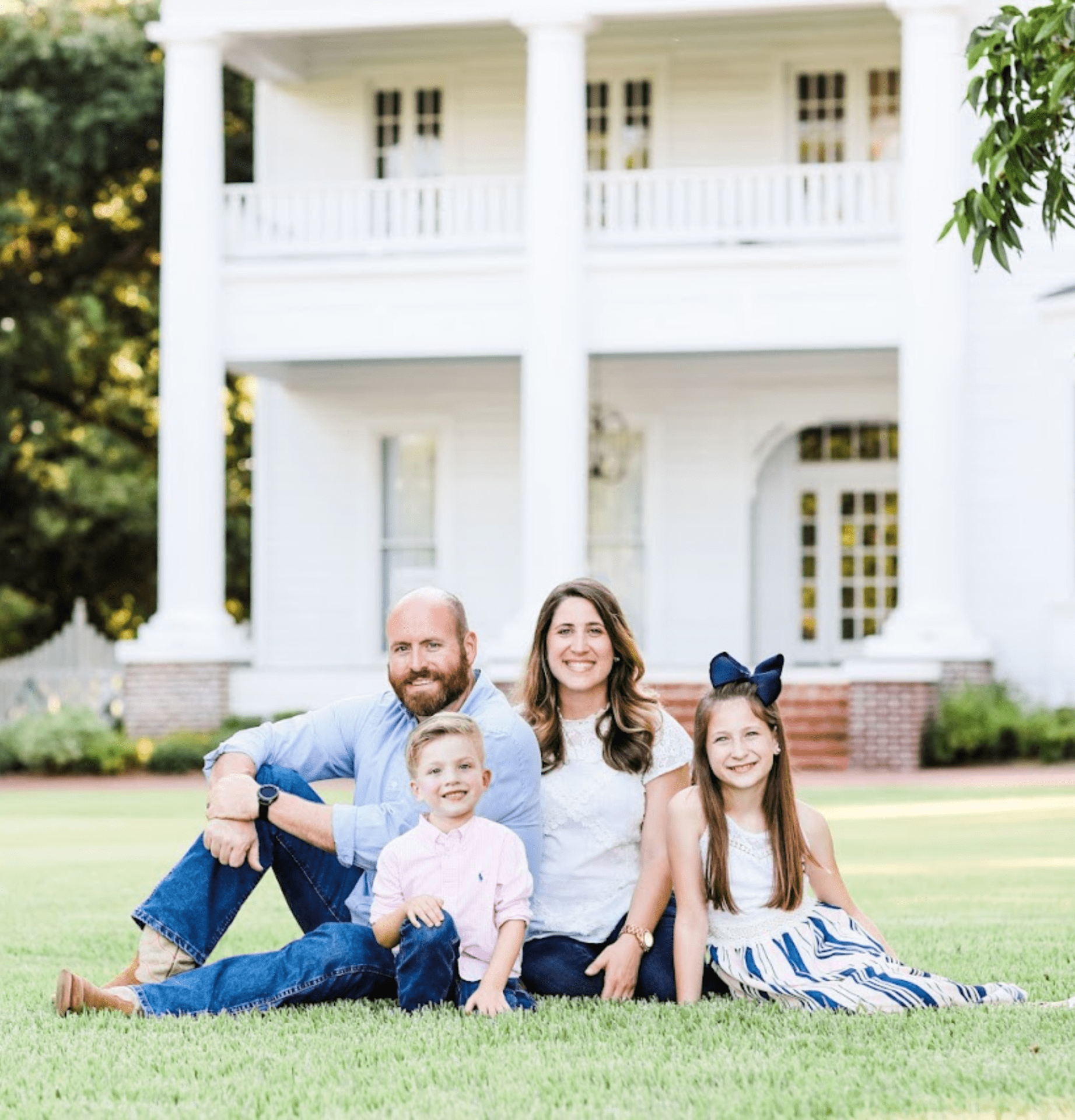 Father and Mother sitting with their son and daughter